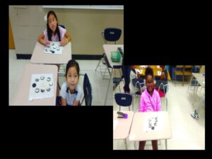 Children in classroom with cookie project on desks.