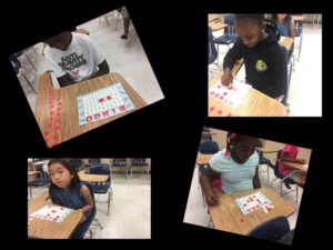 Students playing bingo in classroom.